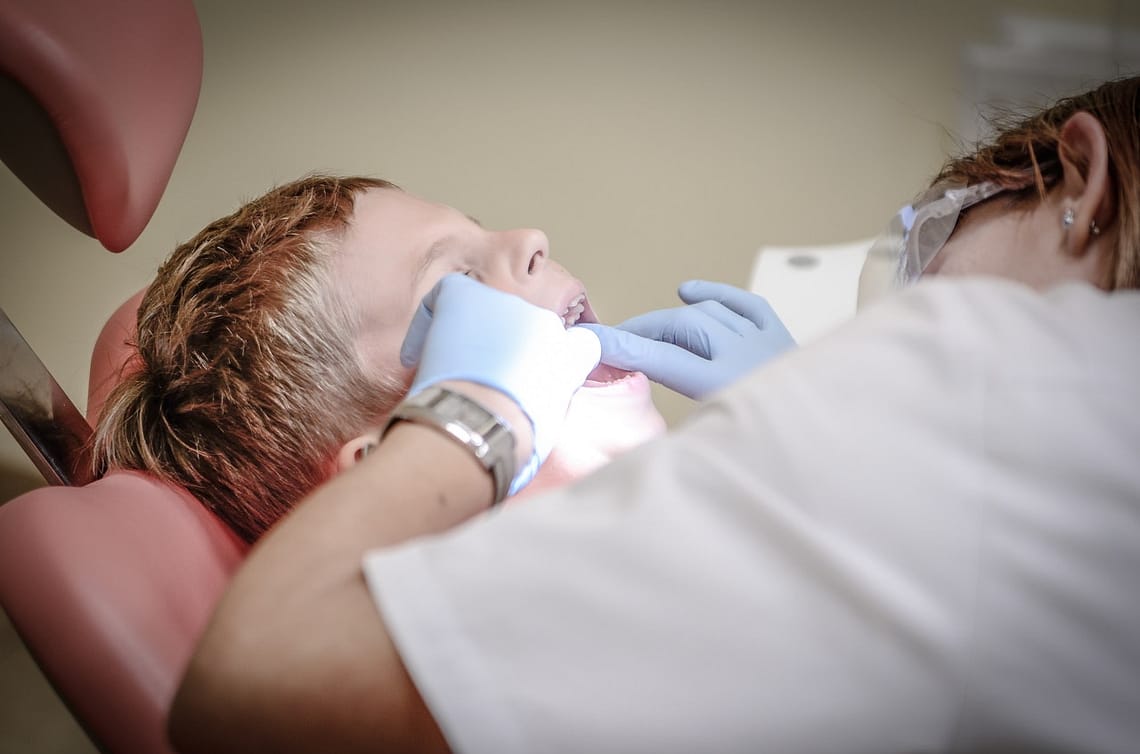 a boy doing dental checkup